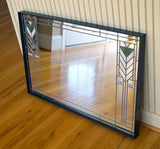 Frank Lloyd Wright Prairie-style mirror sits on floor