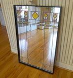 Arts and Crafts mirror with yellow and pink stained glass